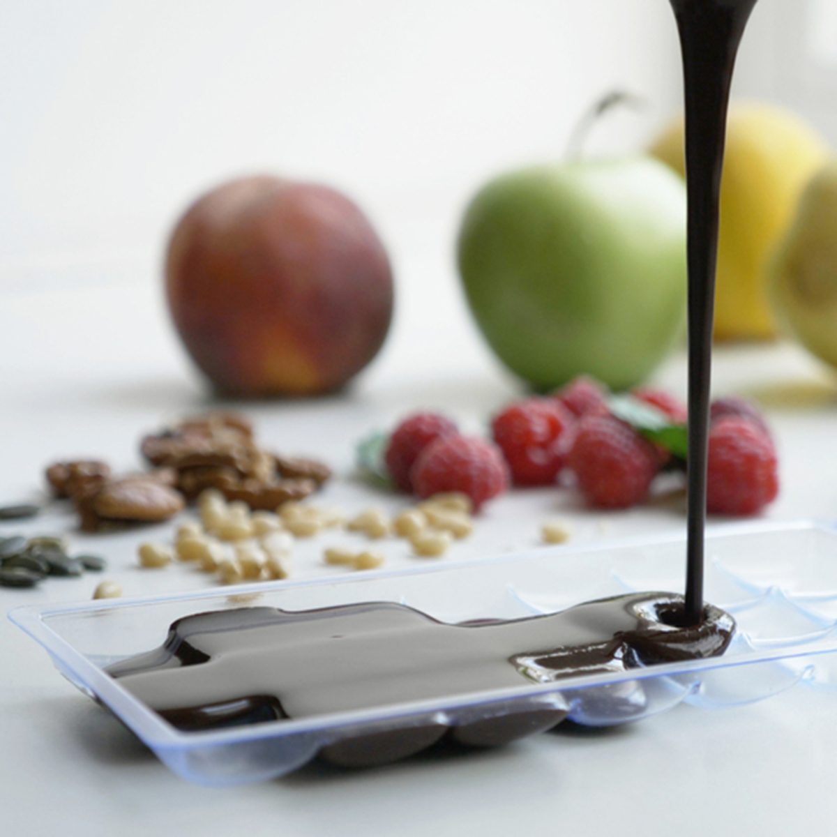 Chocolate fudge pouring into tray. Process of cooking home made chocolate at domestic kitchen; Shutterstock ID 711585034; Job (TFH, TOH, RD, BNB, CWM, CM): Taste of Home