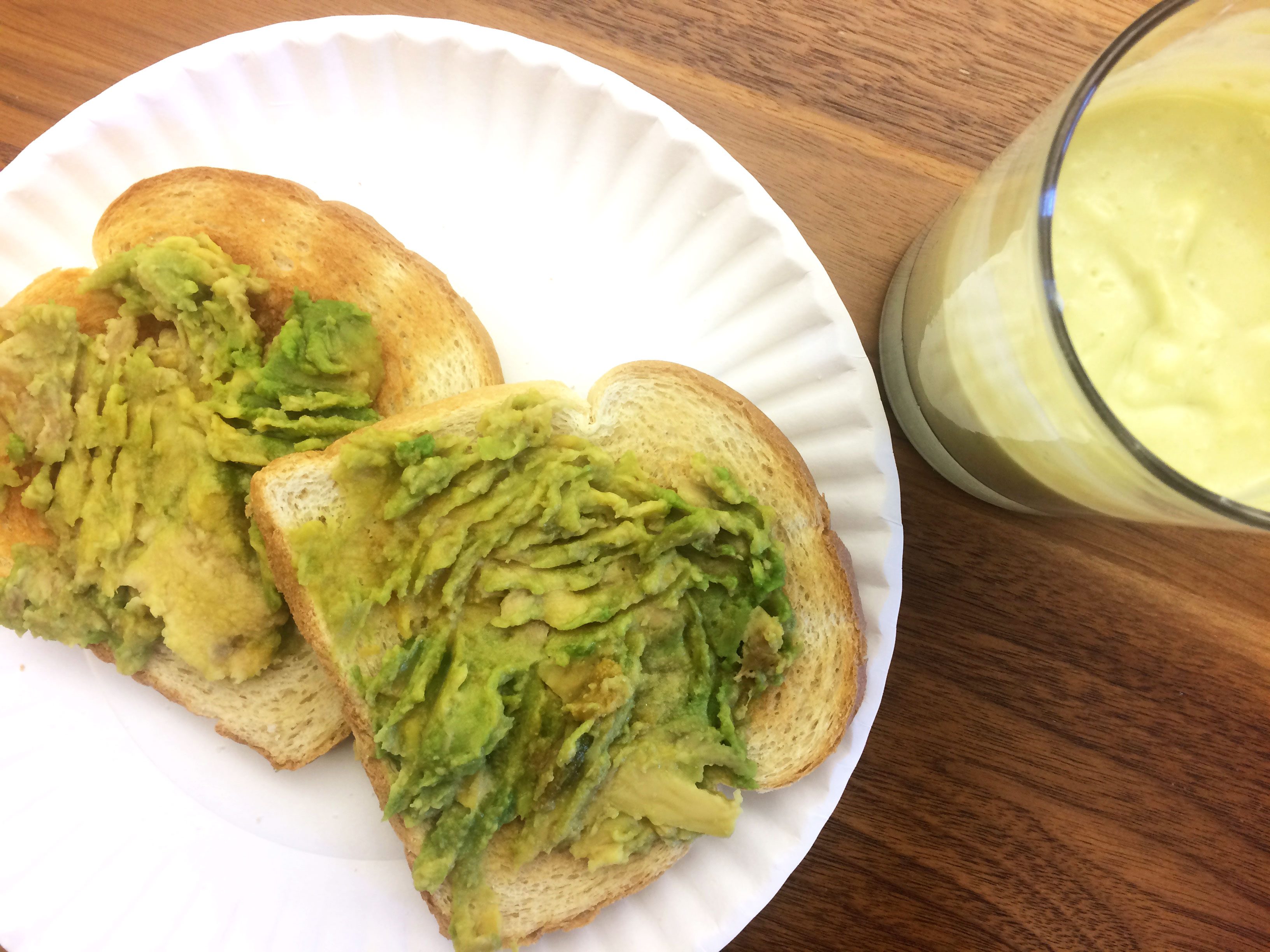 Frozen avocado spread onto two slices of toast