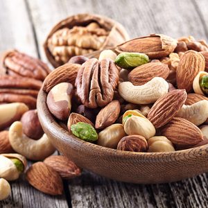 Nuts mix in a wooden plate