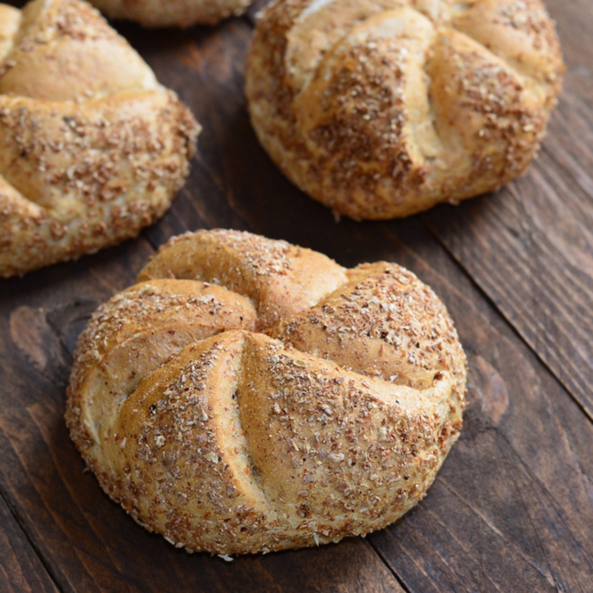 Multigrain buns with free space on wooden background ; Shutterstock ID 231178201; Job (TFH, TOH, RD, BNB, CWM, CM): Taste of Home