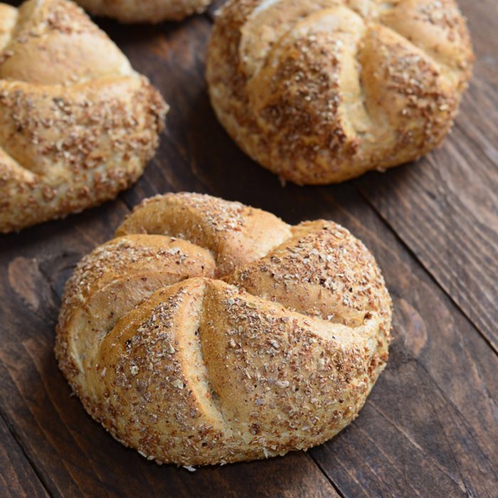 Multigrain buns with free space on wooden background ; Shutterstock ID 231178201; Job (TFH, TOH, RD, BNB, CWM, CM): Taste of Home