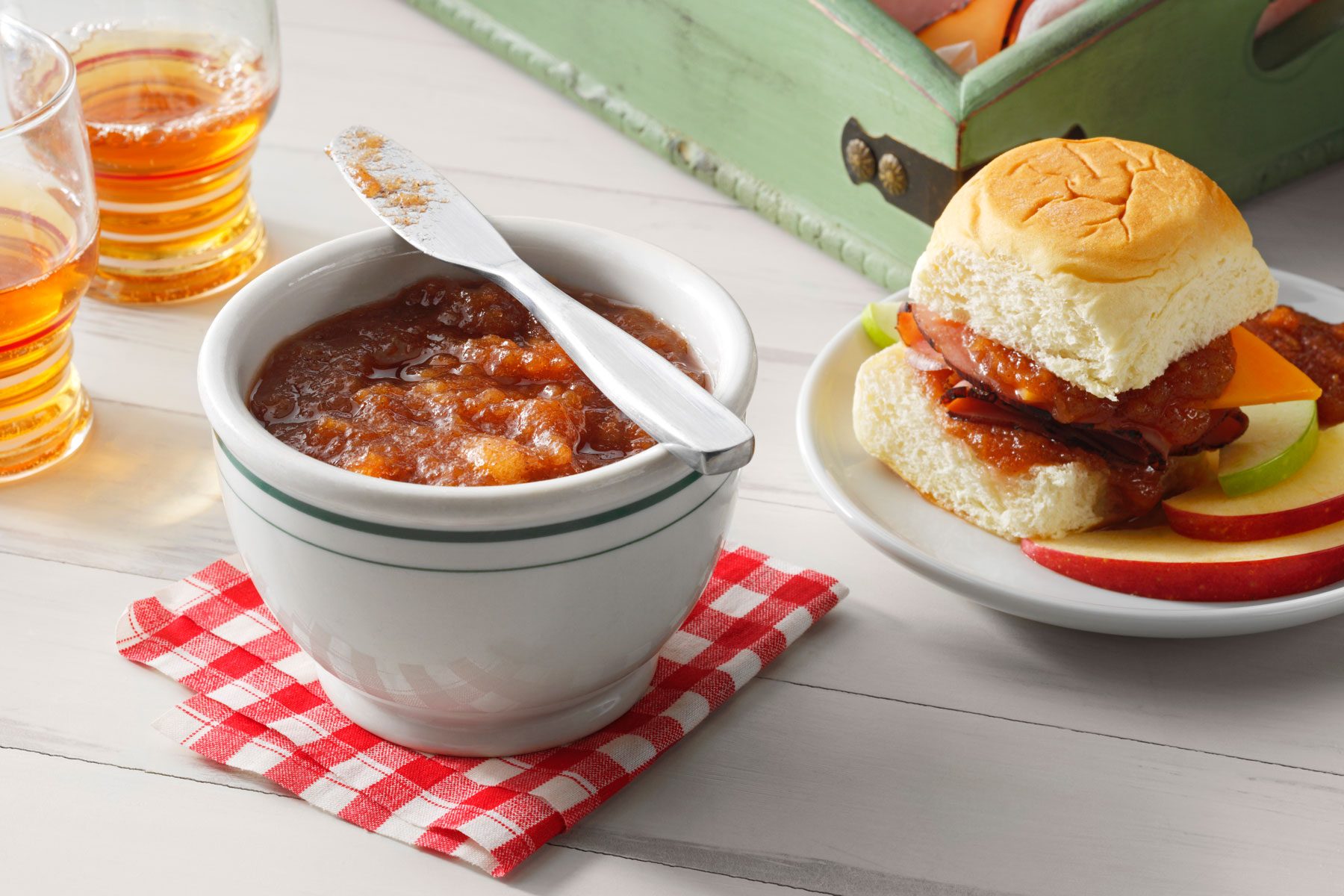 Apple Butter in a bowl on a table with red napkin