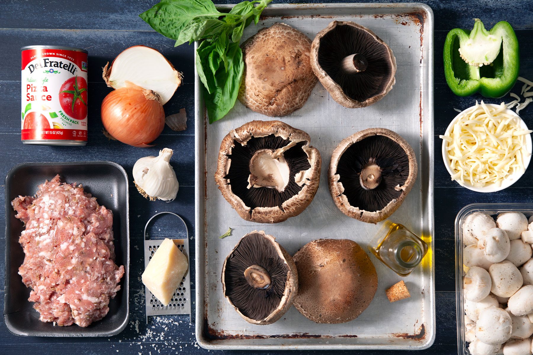 Ingredients on table Portobello mushroom caps Pizza sauce