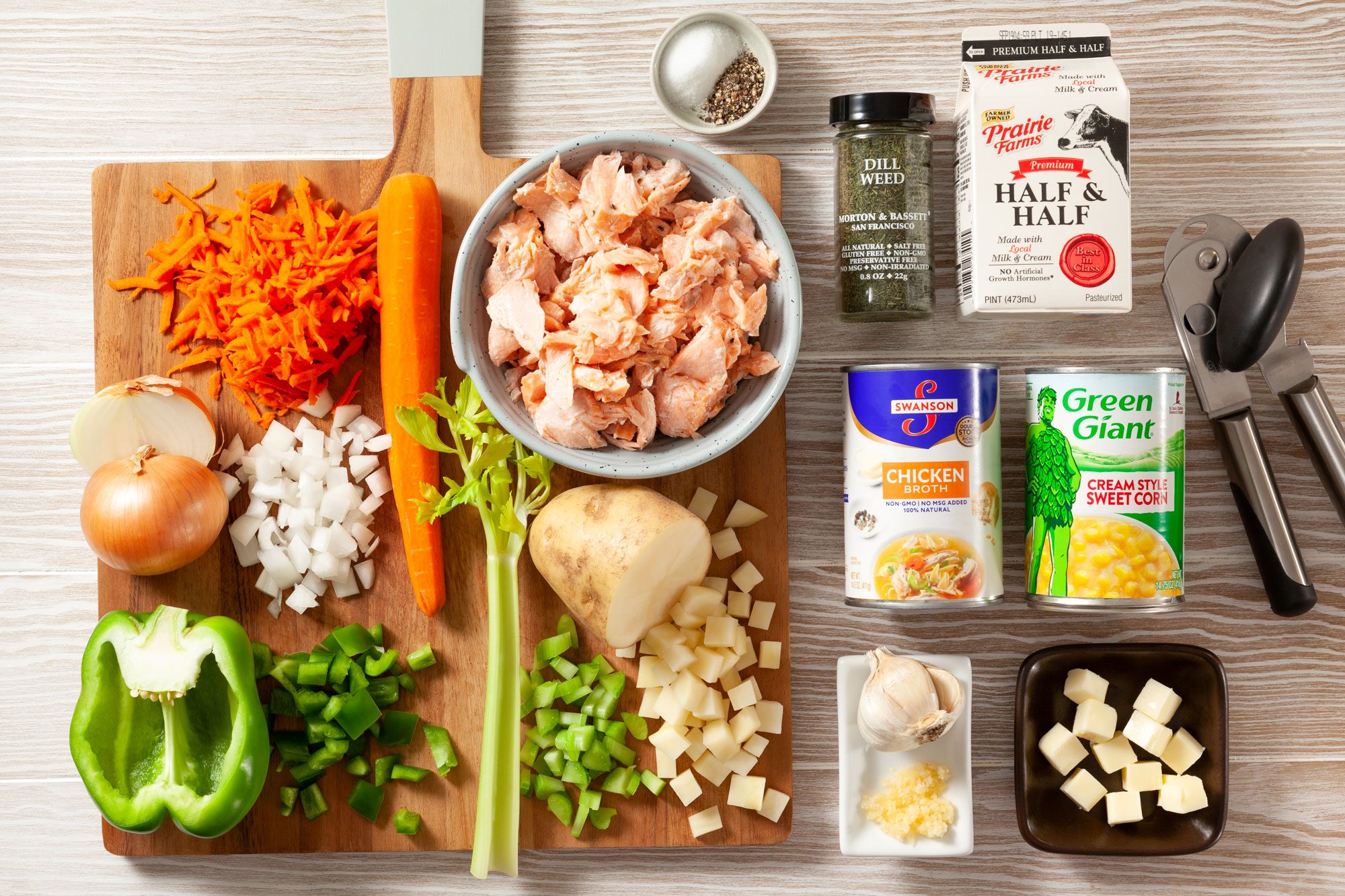 All Ingredients for Salmon Chowder on Wooden Surface