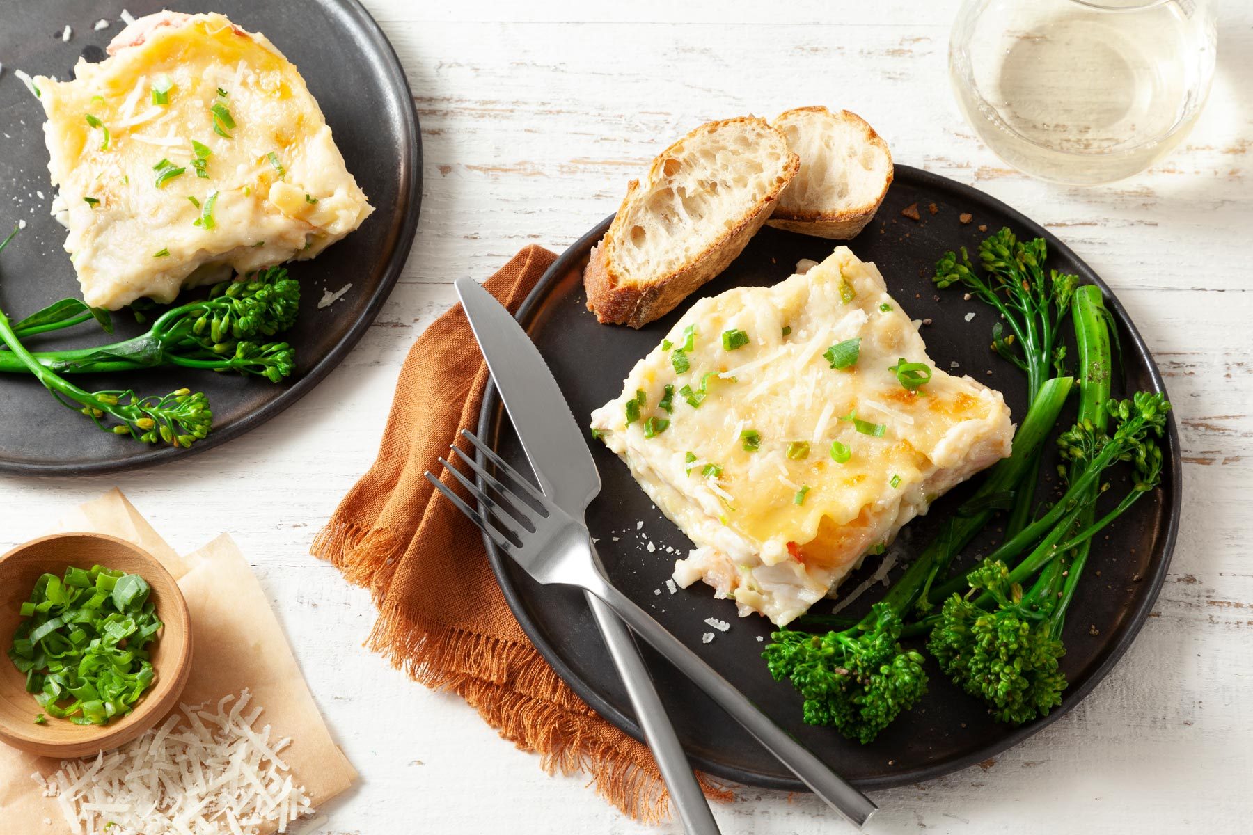 A Plate of Seafood Lasagna With a Fork and Knife
