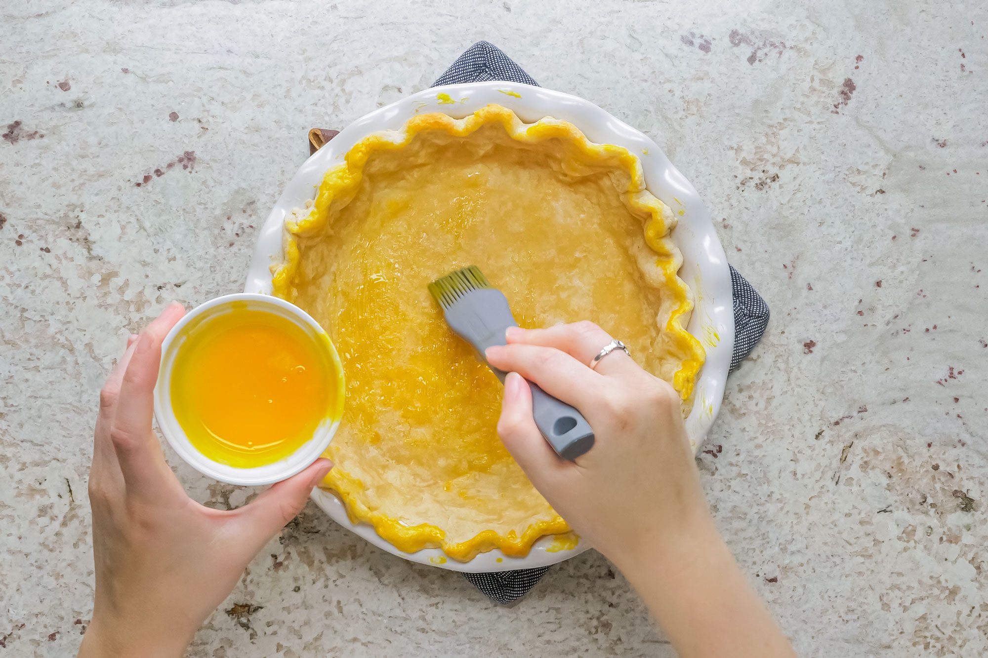Glaze the pie crust with egg yolk