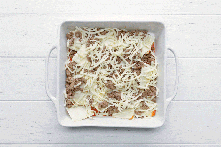 adding second layer of ravioli lasagna