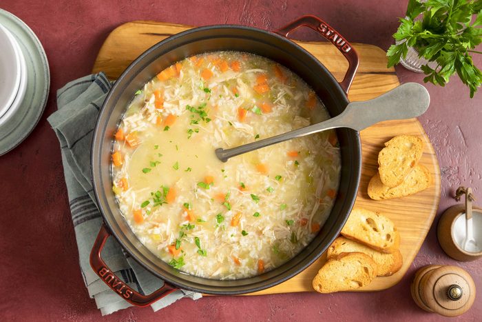 Turkey Soup in Soup Pot on Wooden Chopping Board