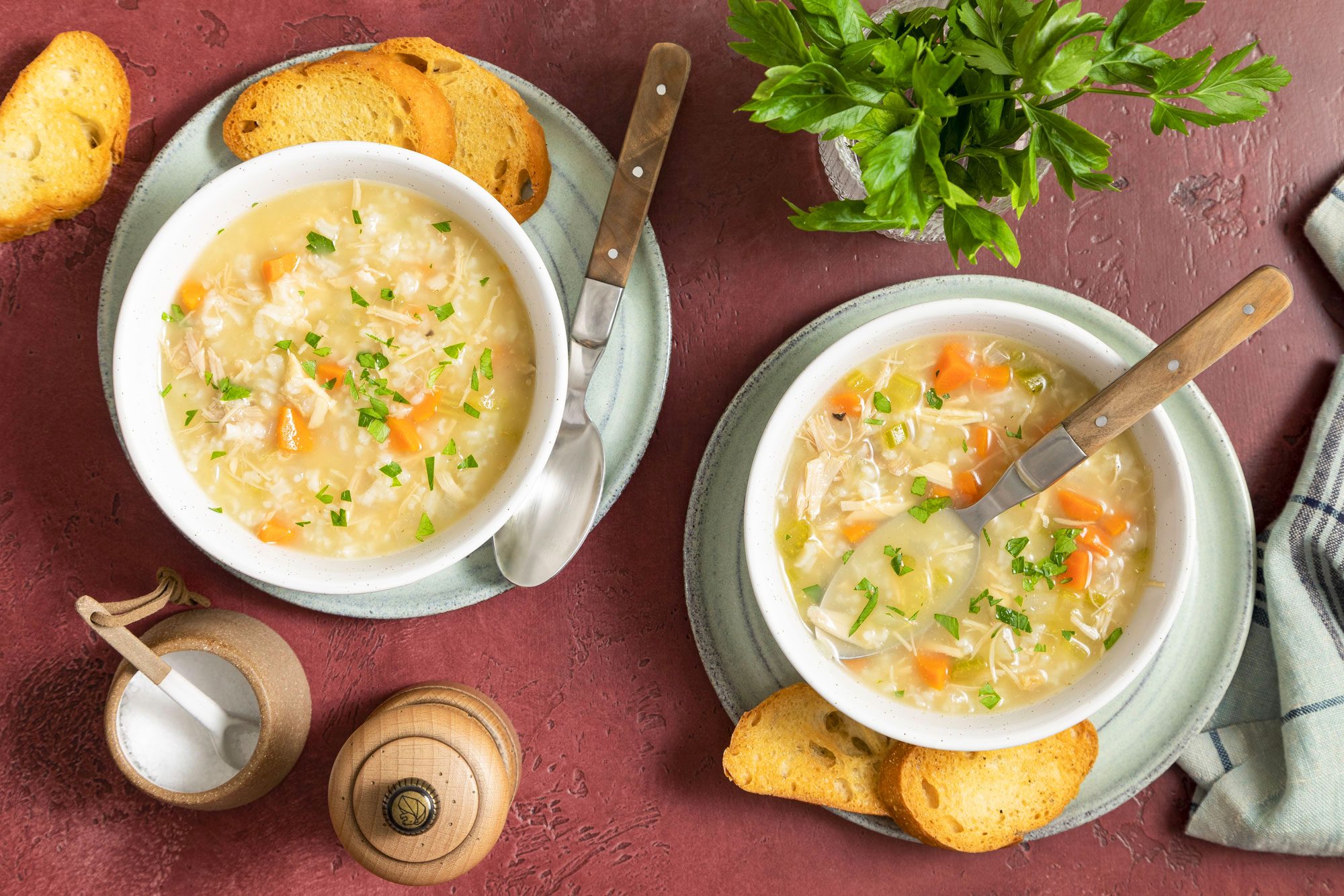 Turkey Soup Served in Ceramic Bowls with Spoons