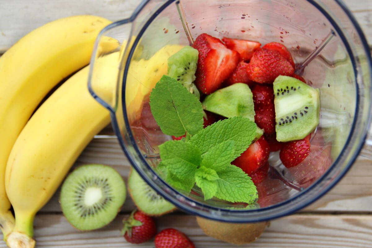 Fresh vivid smoothie ingredients and blender