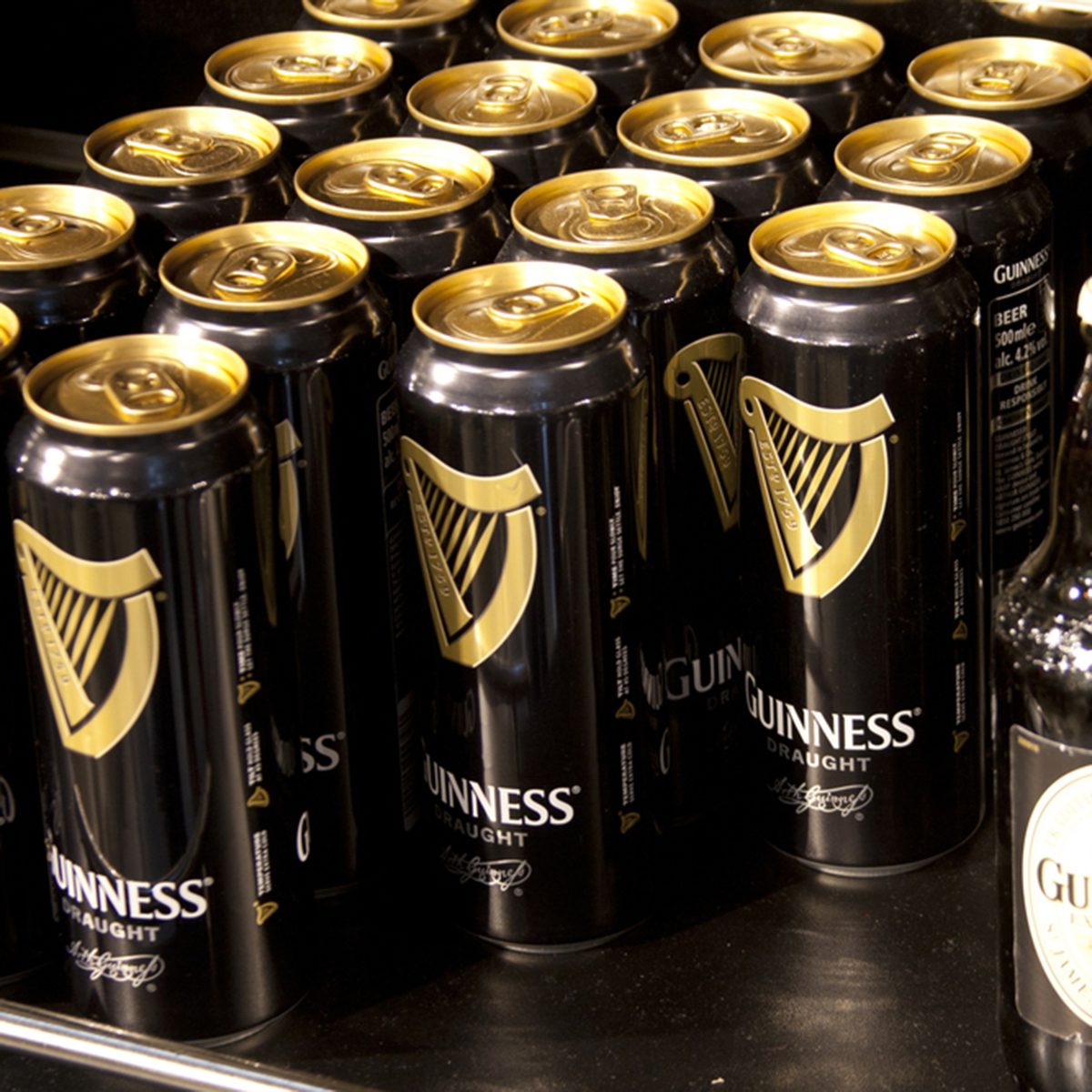 DUBLIN-MAY 29 2011:Bottles and cans of Guinness for sale. Guinness is one of the worlds most successful beers selling over 18 million pints worldwide every year.Dublin May 29 2011