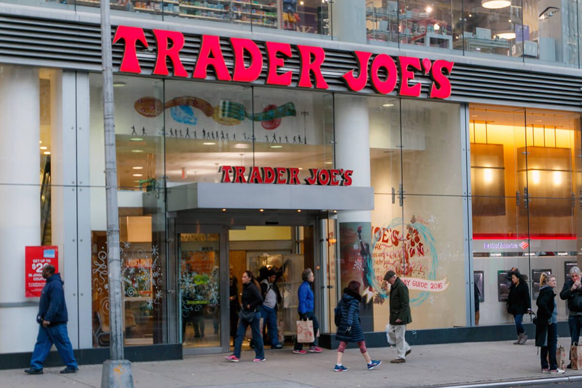 People walk by a Trader Joe