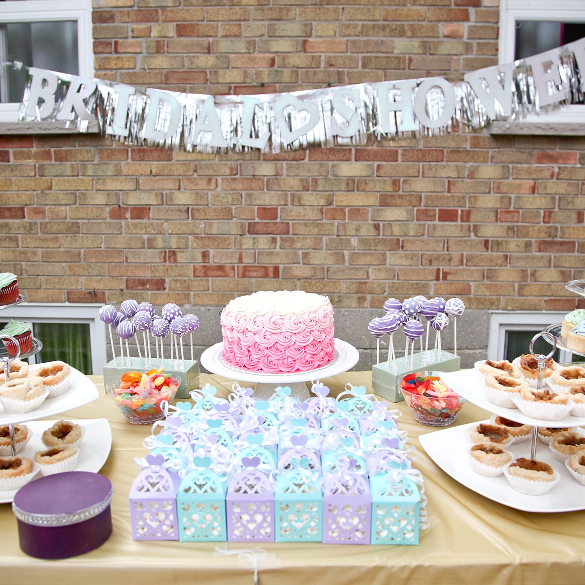 bridal shower party dessert table with party favors