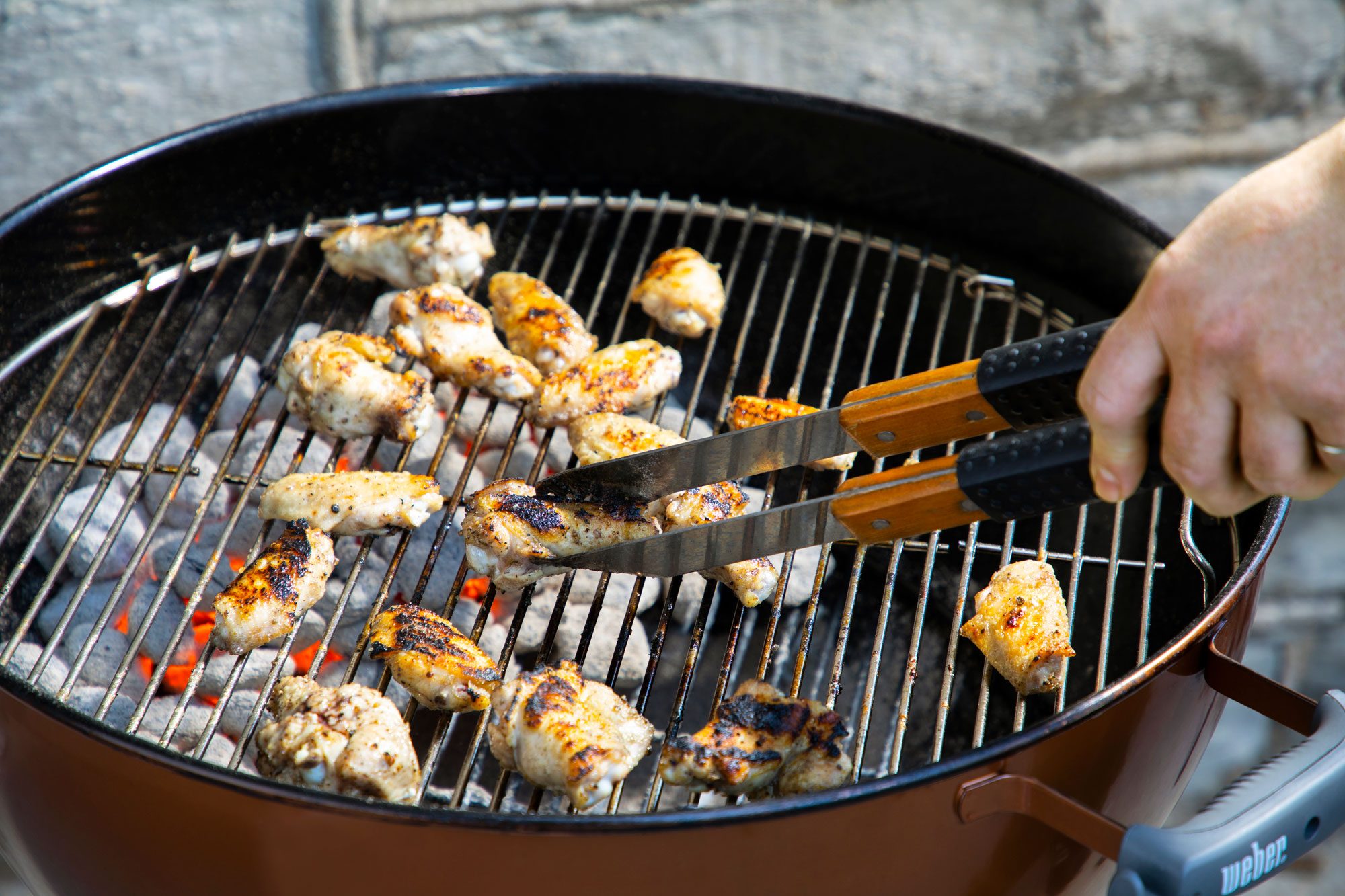 chicken wings cooking on grill