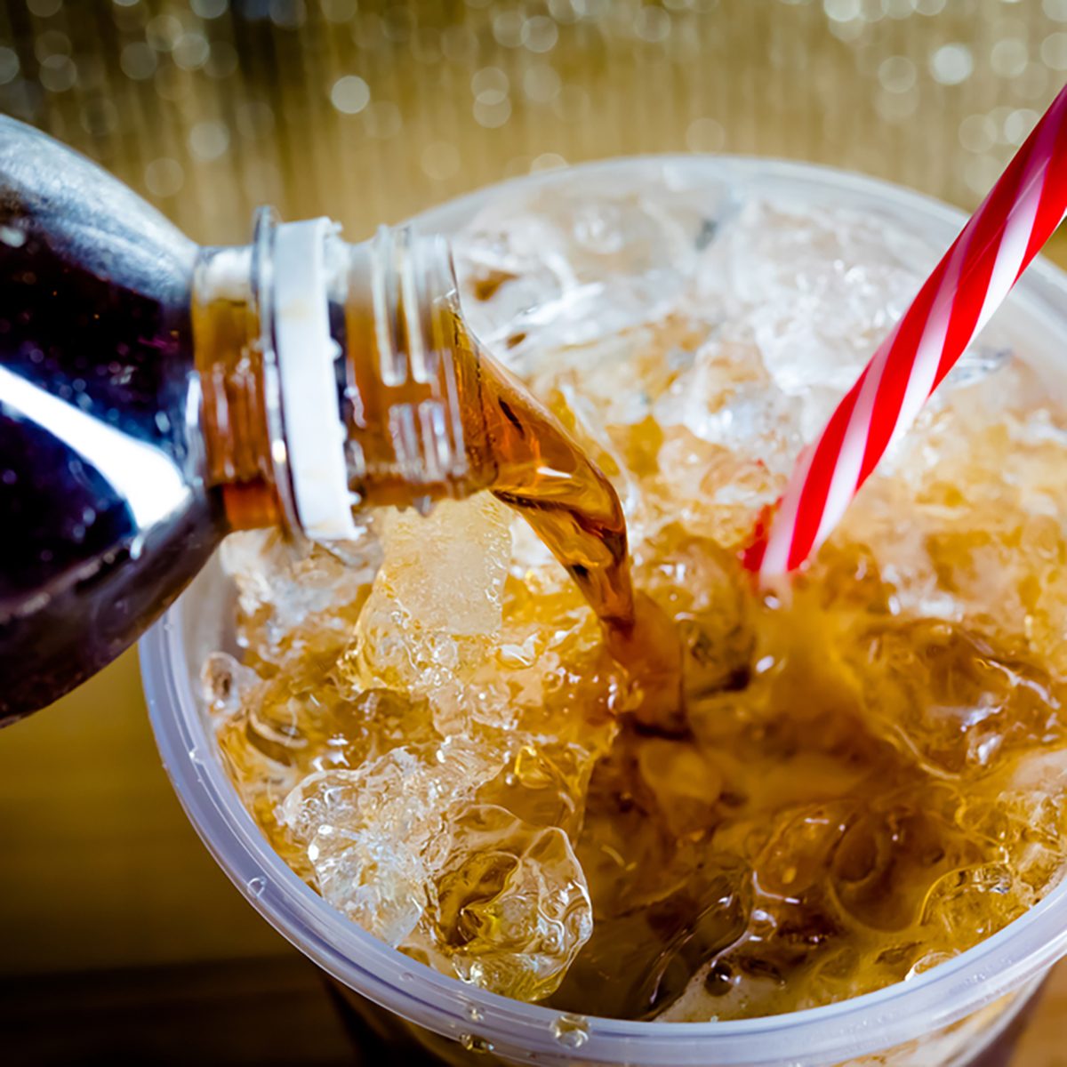 Refreshing Bubbly Soda Pop with Ice Cubes. Cold soda iced drink in a glasses - Selective focus, shallow DOF
