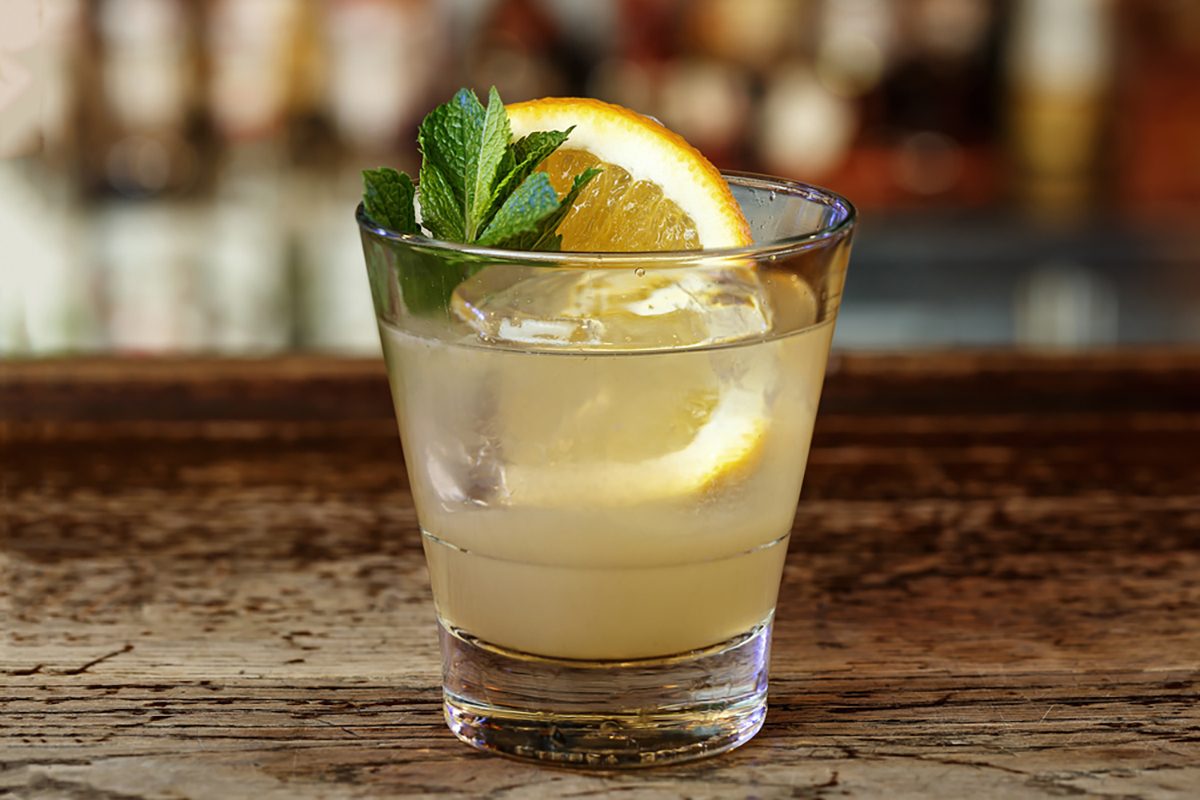 Classic American cocktail Southside based on gin, lemon juice, vodka, syrup and mint