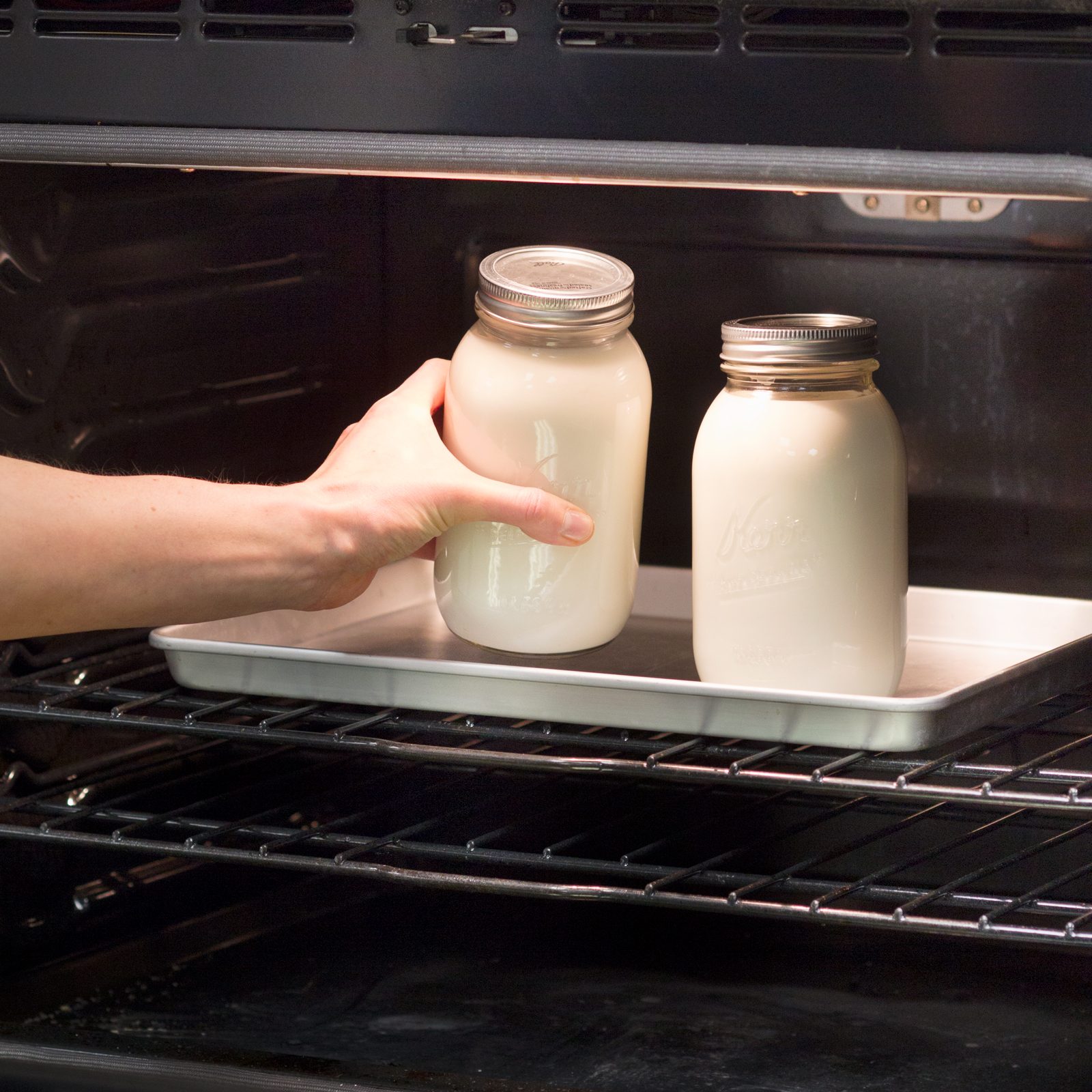 two filled mason jars in the oven