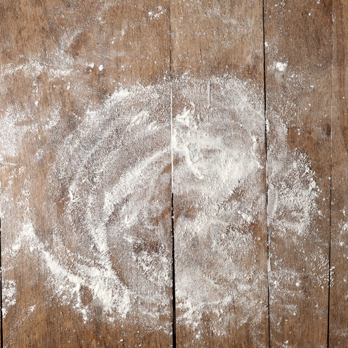white flour on rustic wooden table, top view; Shutterstock ID 521824987