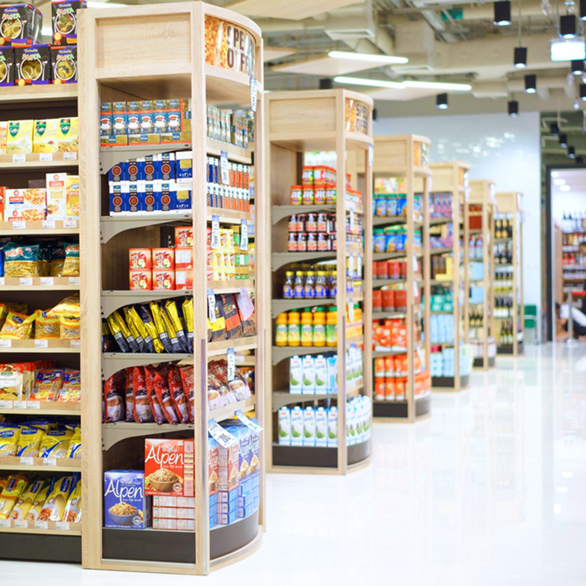 Muang Nakhonratchasima, 3 JANUARY 2017: Rows of shelves in Foodlland supermarket in Muang district, Nakhonratchasima province, Thailand. Foodland is a hypermarket chain in Thailand; Shutterstock ID 549834283