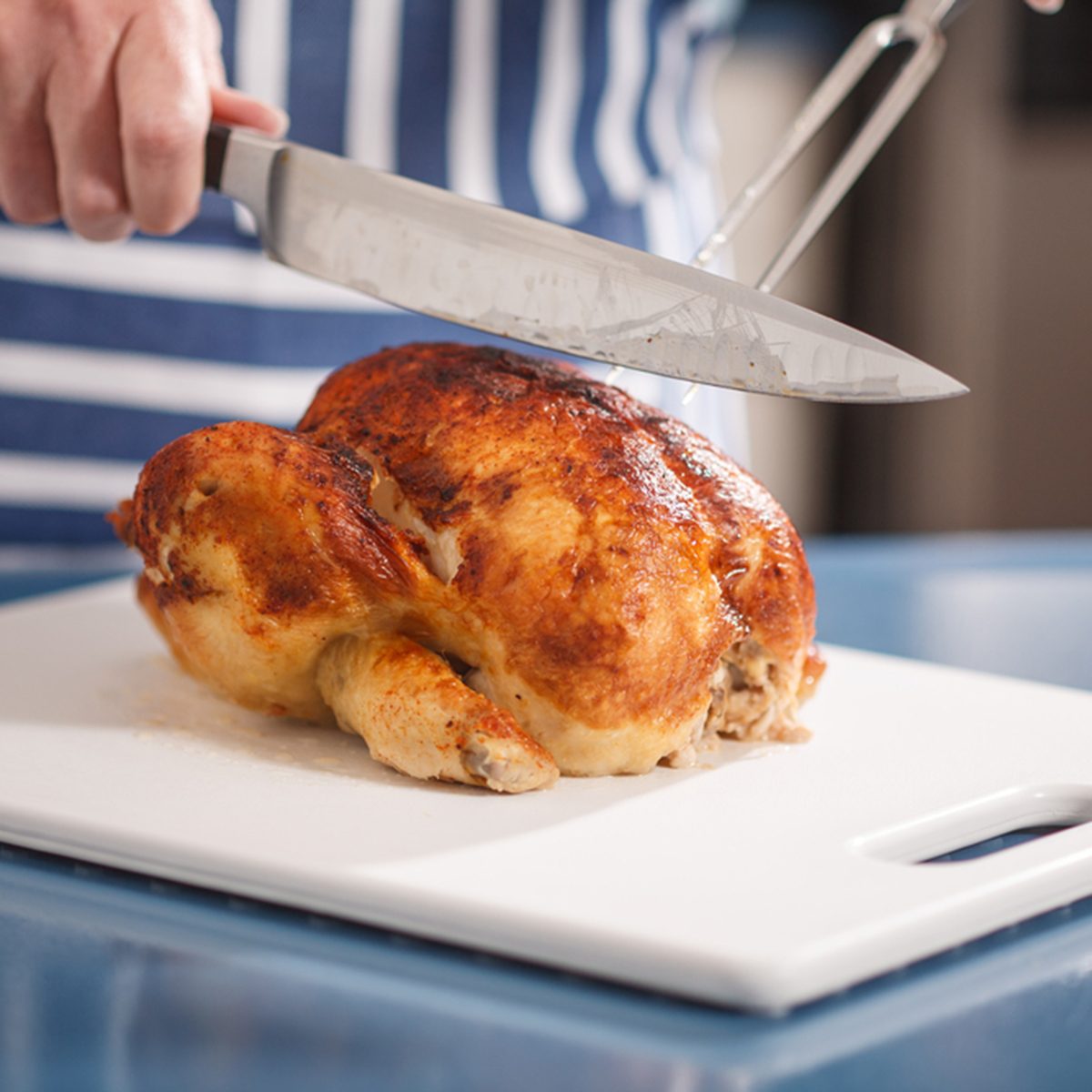 Slicing Chicken on cutting board