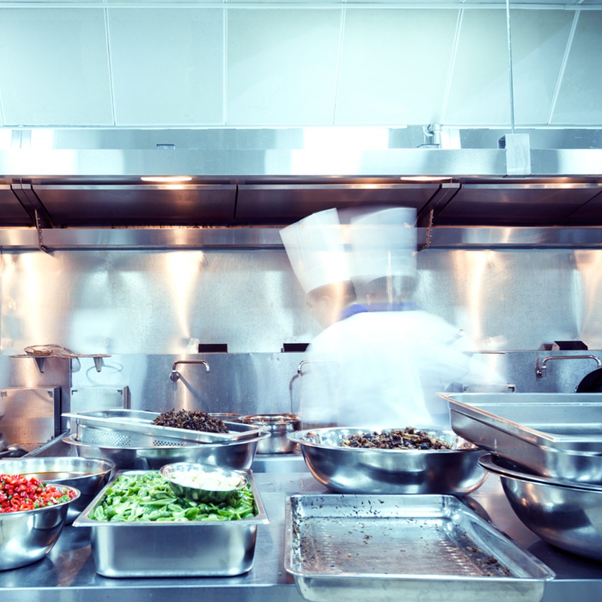 motion chefs of a restaurant kitchen
