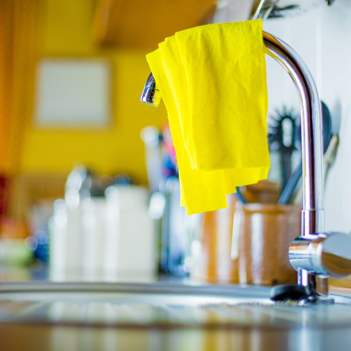 An unhygienic dishcloth lies on a sink