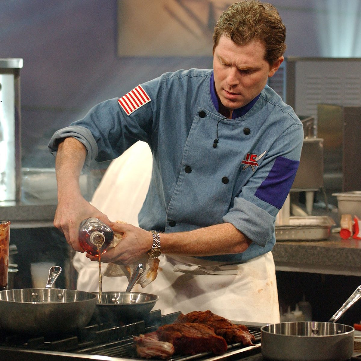 Mandatory Credit: Photo by JIM COOPER/AP/REX/Shutterstock (6405851a) Iron Chef Bobby Flay of Mesa Grill in New York works on the grill during the taping of the 
