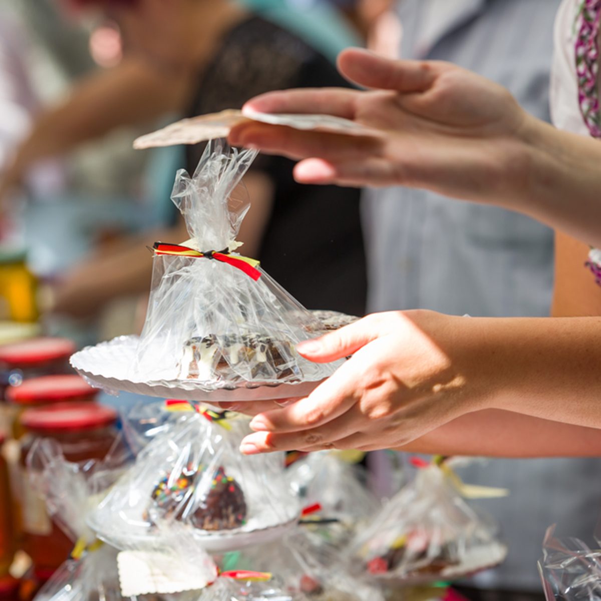 woman hand give dessert on plate