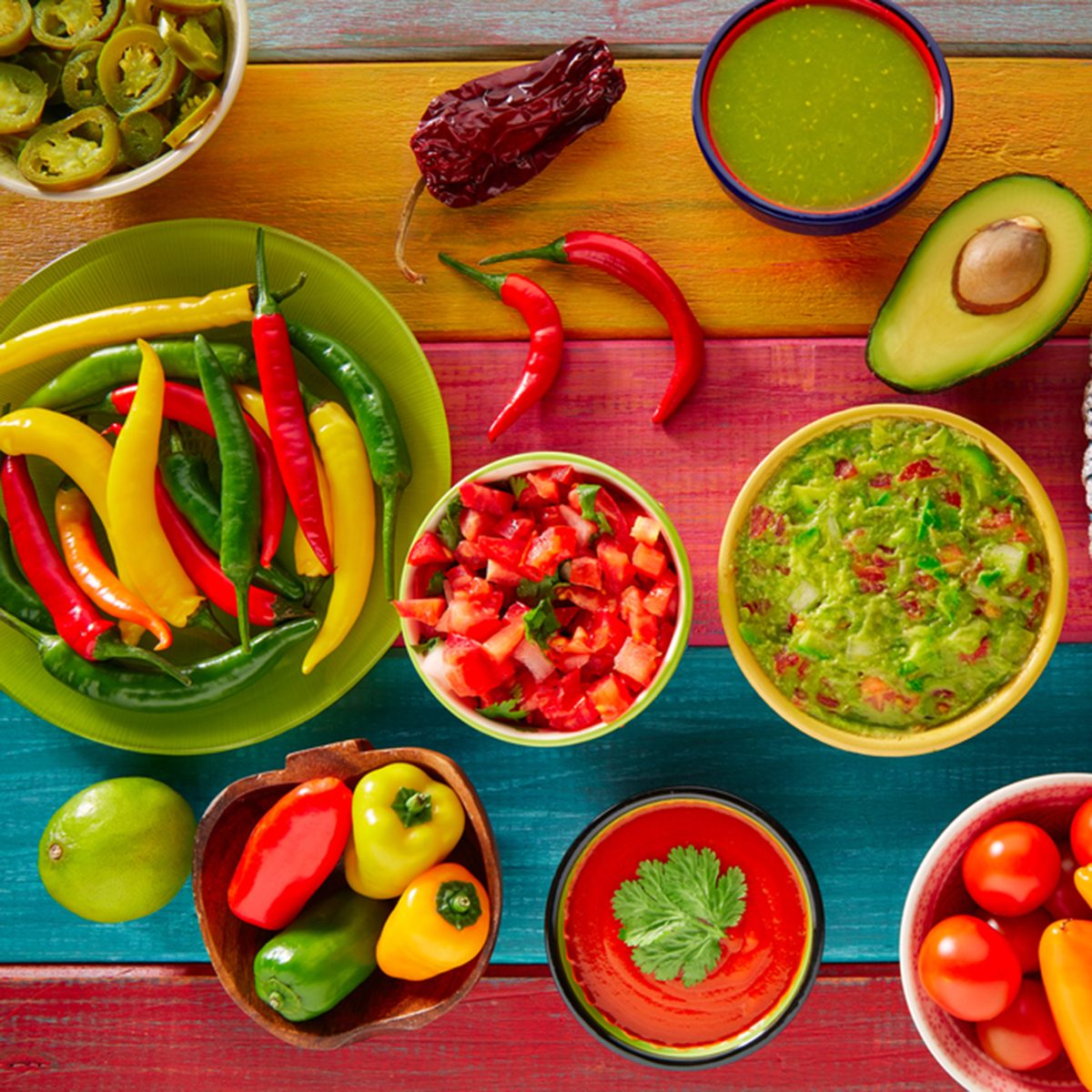 Mexican food mixed guacamole nachos chili sauce dipping cheddar cheese lemon pico de gallo