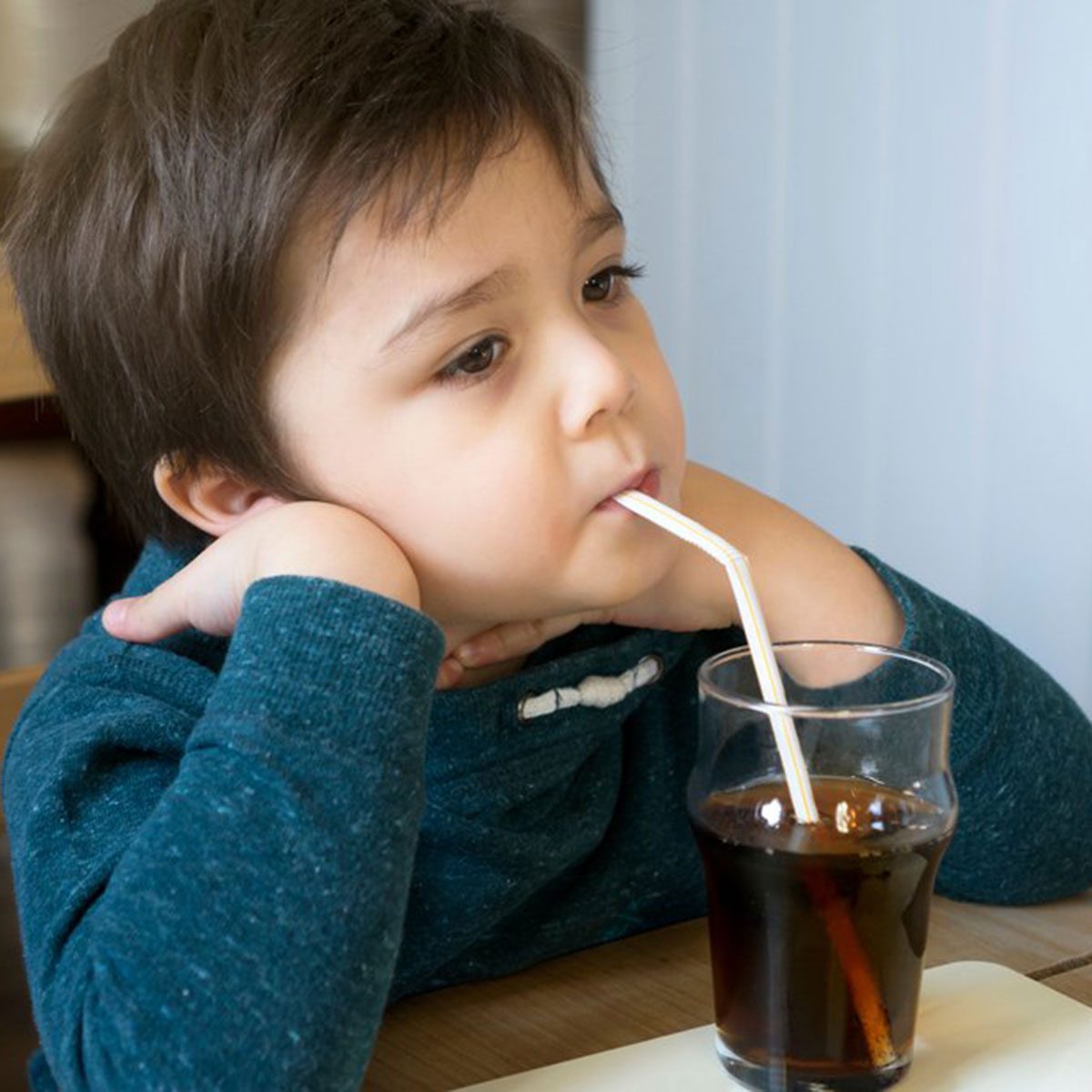 Kid drinking soda