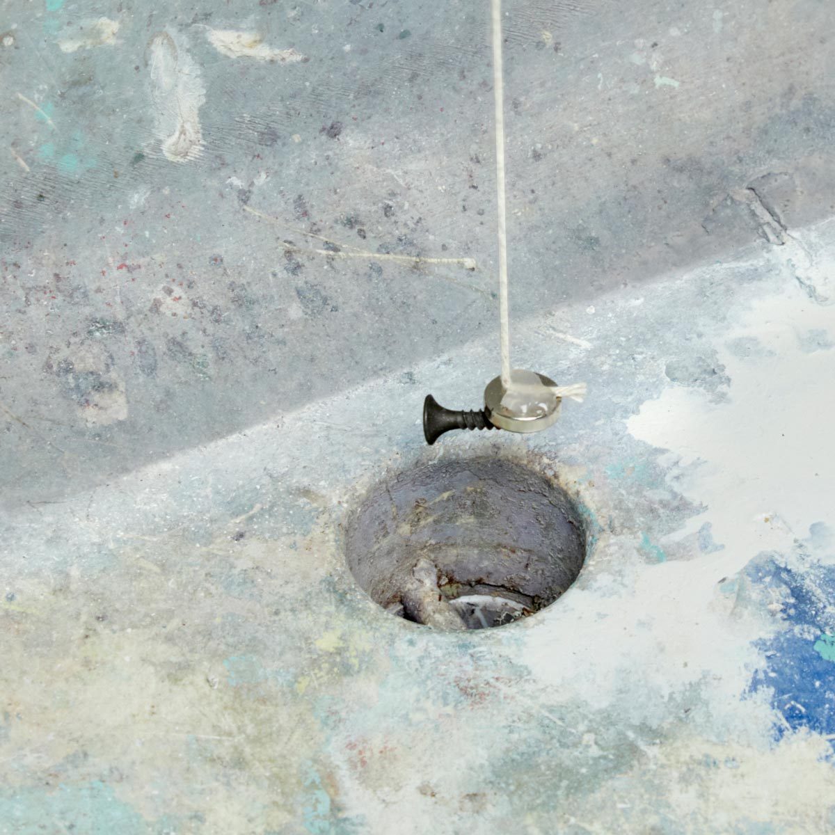 Pulling a screw from a drain