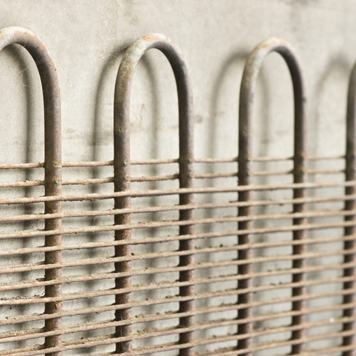 old heating radiator coils at the back of refrigerator