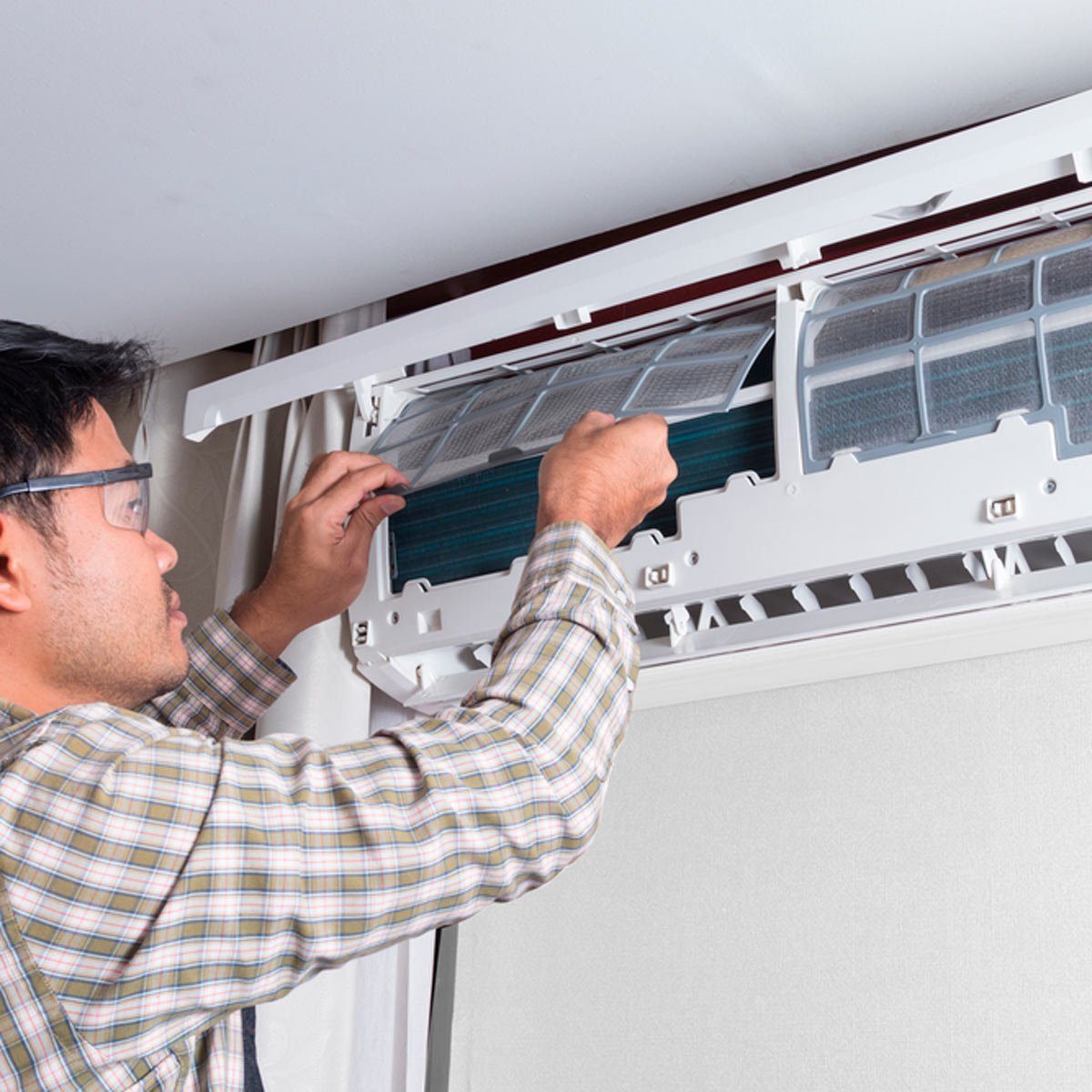 Man working on air conditioner