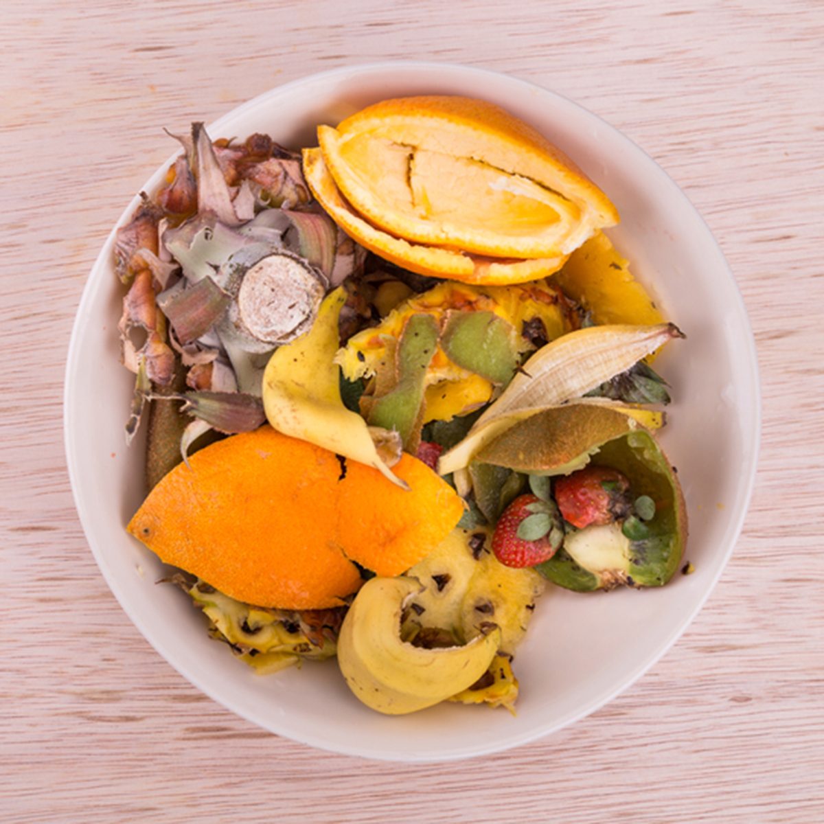 Bowl of household vegetable and fruits refuse and garbage collected for compost preparation; Shutterstock ID 743217673
