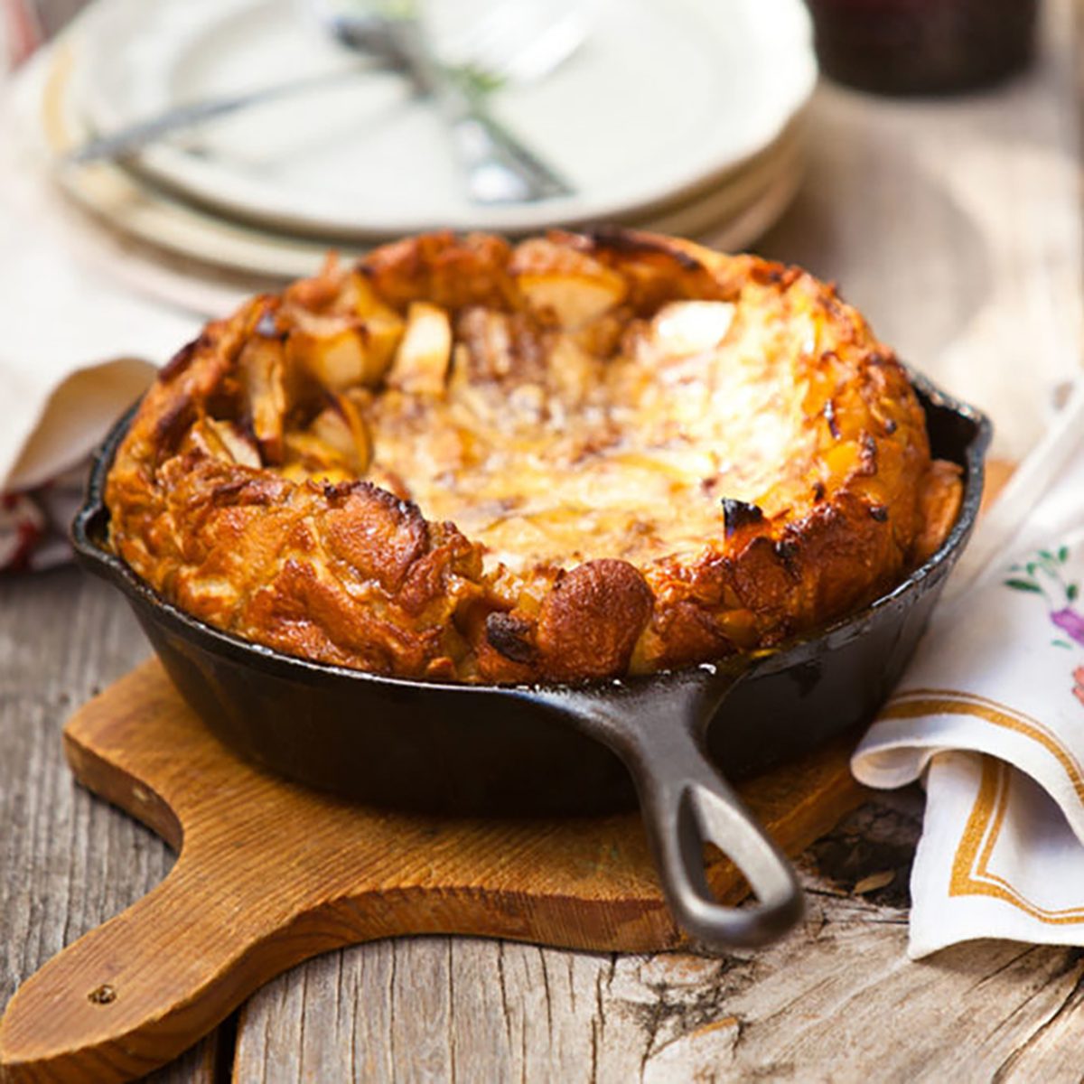 Dutch baby pancake in a cast iron skillet prepared for serving.
