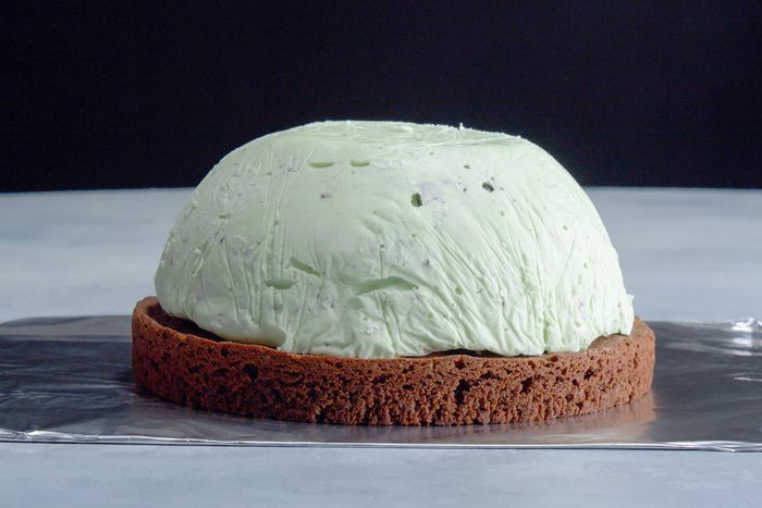 pieces of baked alaska being assemble on tin foil surface