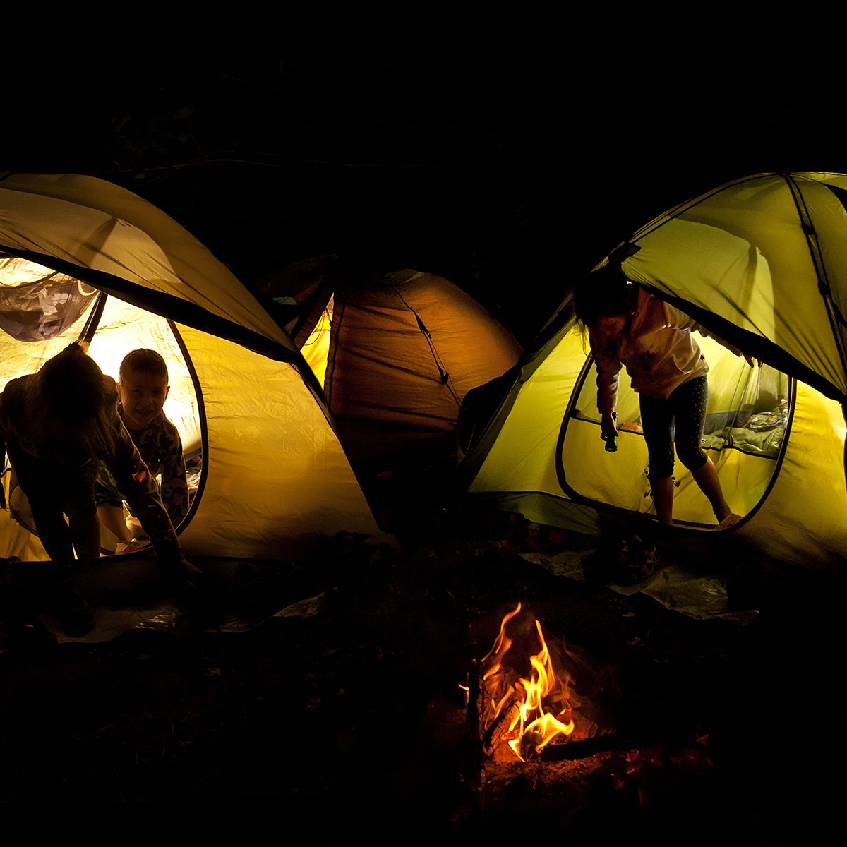 The tent lights at night from the flashlight.