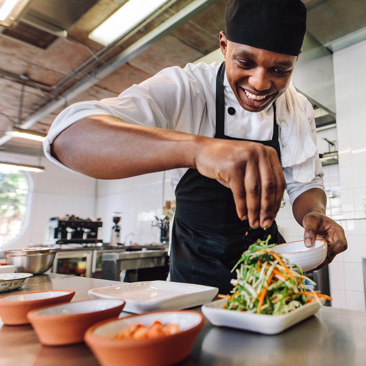 Male chef preparing salad in kitchen. Gourmet chef making delicious dish in restaurant kitchen.; Shutterstock ID 746467468; Job (TFH, TOH, RD, BNB, CWM, CM): Taste of Home