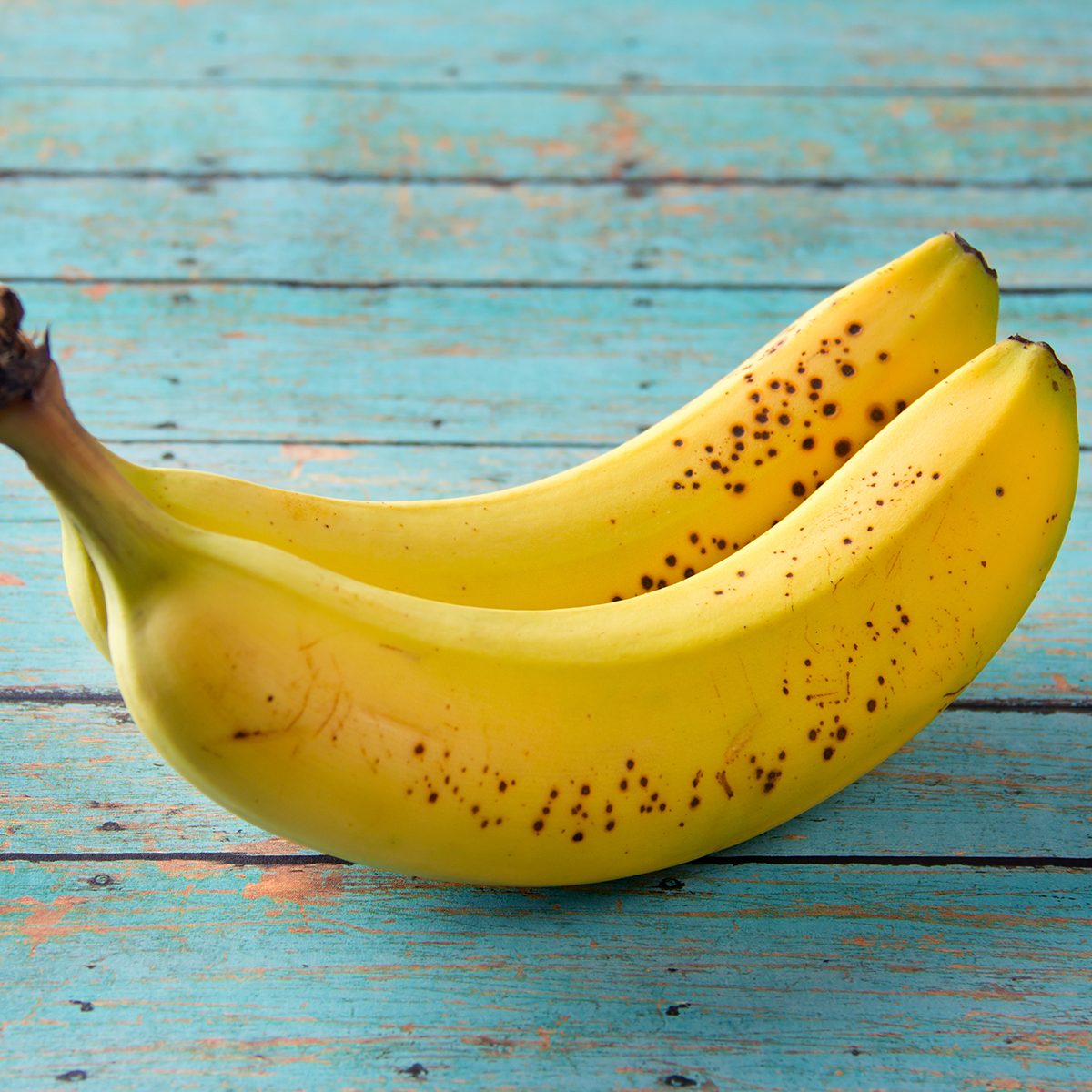 Bananas on a wooden picnic table