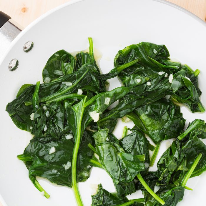 Fresh cooked spinach in a pan.