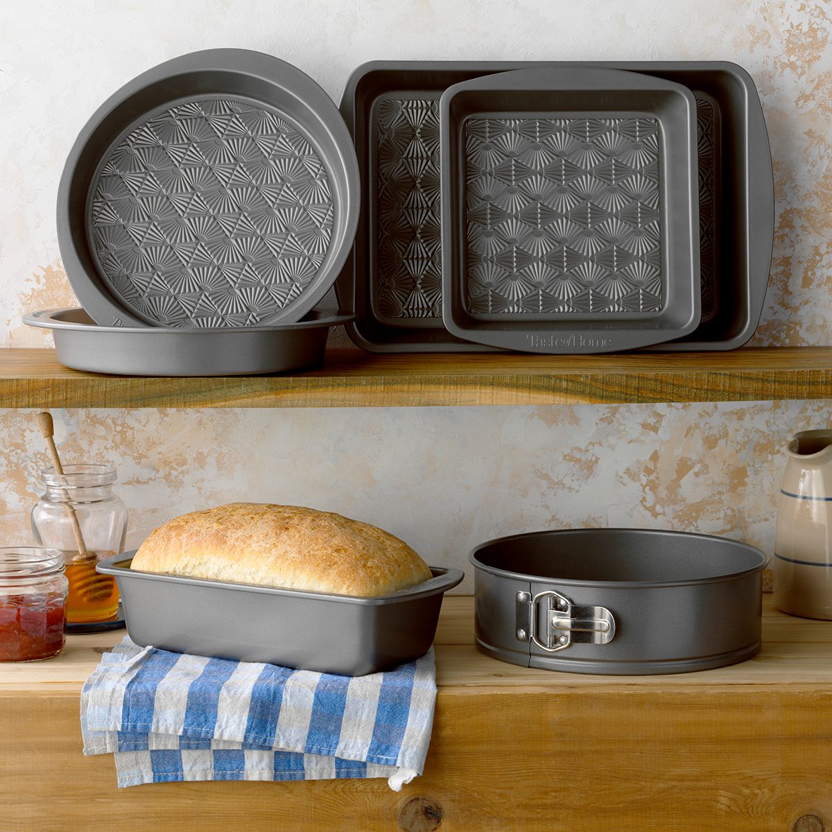 Taste of Home Bakeware on shelves in rustic environment