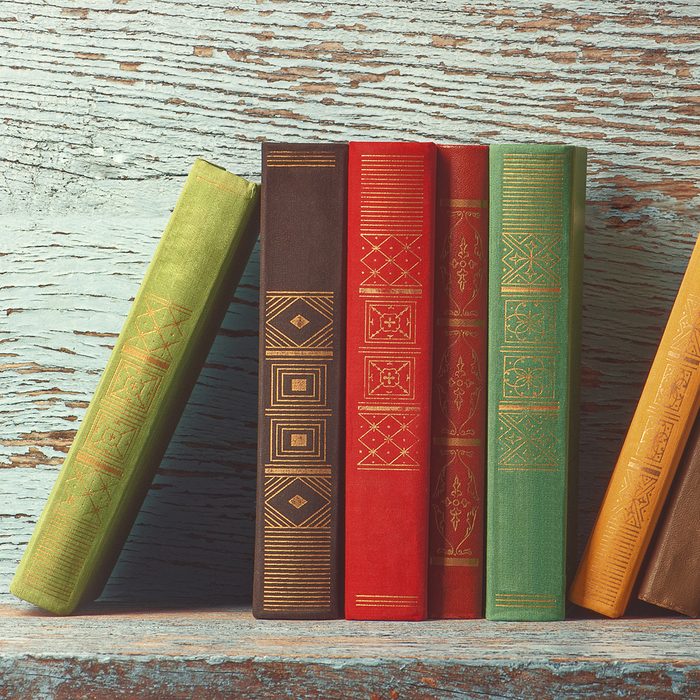 old books on the background of a wooden