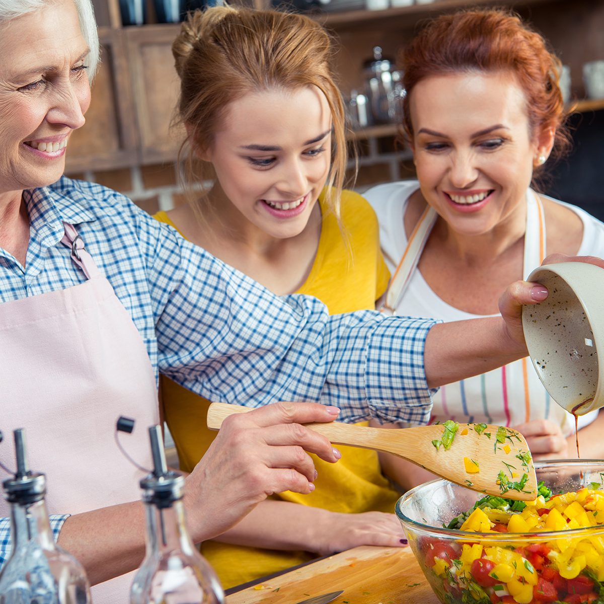 Everything old is new again, 2020 food trends, Happy three-generation family cooking vegetable salad together in kitchen ; Shutterstock ID 549151045; Job (TFH, TOH, RD, BNB, CWM, CM): Taste of Home