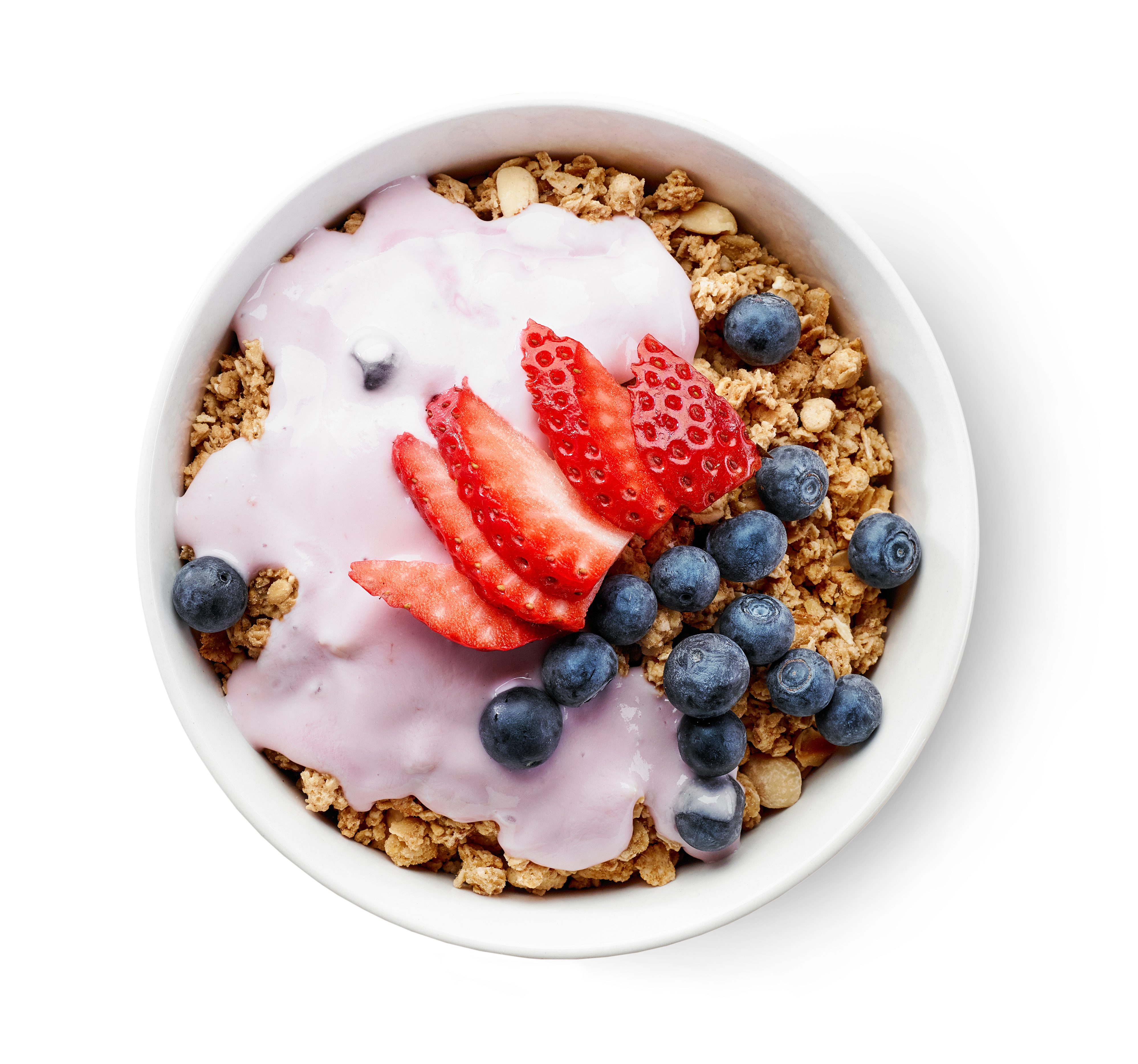 bowl of granola with yogurt and berries isolated on white background, top view