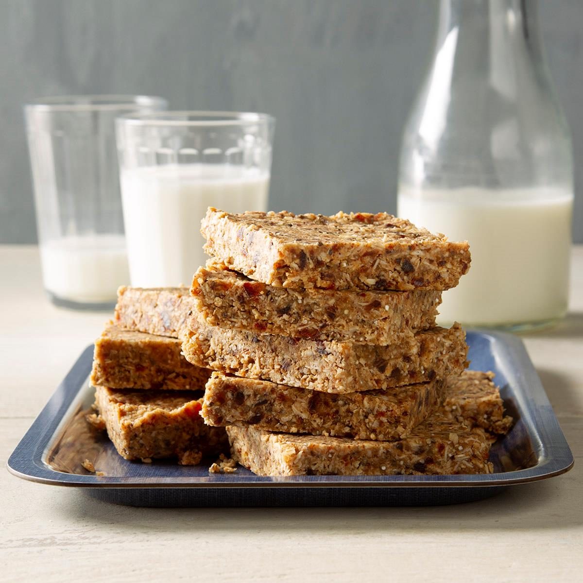 dried fruit energy bars stacked on a plate