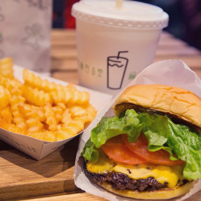 CHICAGO, IL - JANUARY 28: In this photo illustration a cheeseburger and french fries are served up at a Shake Shack restaurant on January 28, 2015 in Chicago, Illinois. The burger chain, with currently has 63 locations, is expected to go public this week with an IPO priced between $17 to $19 a share. The company will trade on the New York Stock Exchange under the ticker symbol SHAK. (Photo Illustration by Scott Olson/Getty Images)
