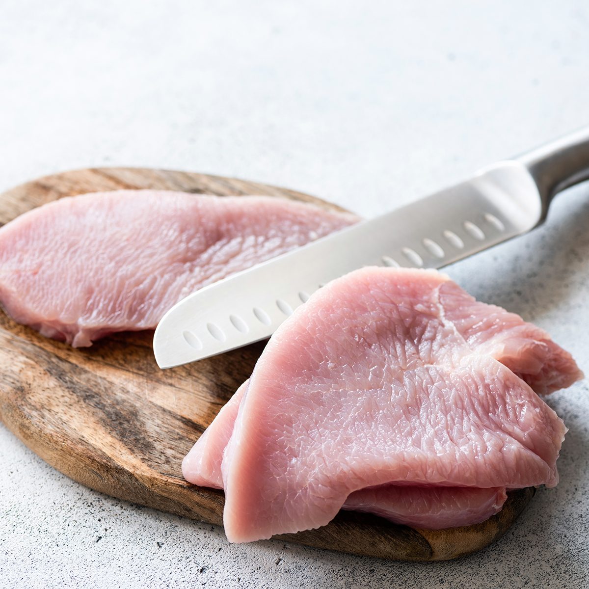 meats for diabetics Raw turkey meat steaks on a wooden cutting board. Meat ready for cooking