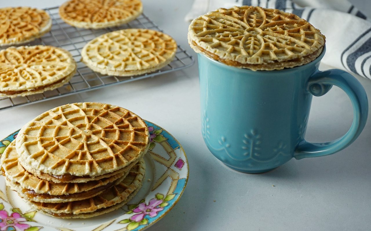 warming a stroopwafel over a cup of hot coffee