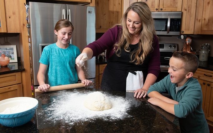 Cristen Clark cooking with her tow kids