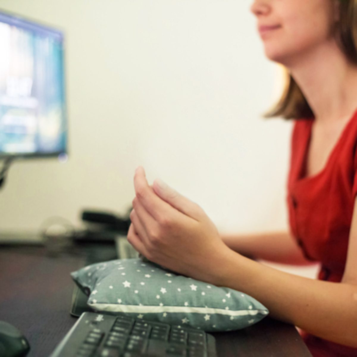 A cute kitten lying and sleeping on an office table